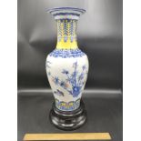 Large Chinese vase signed to base comes with stand depicting bird scene over 12 inches in height .af