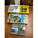 3 boxed train building kits .