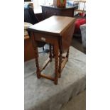 Antique light oak barley twist drop leaf table .