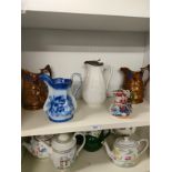Shelf of Victorian graduated jugs etc .