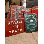 2 reproduction signs , beware of train .