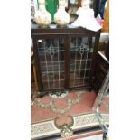 Antique China cabinet with fitted glass leaded doors . Af.