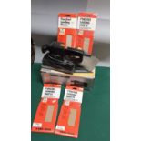 Boxed black n decker sander with lot of sanding punch sheets still in packet .