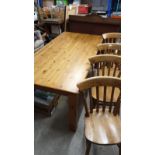 Large farm house pine table with 4 chairs .