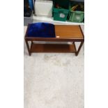 Mid century teak telephone table with blue upholstery.