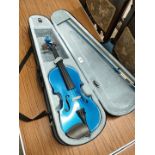 Harlequin Stentor blue violin with bow and case.