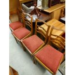 Set of 4 retro teak chairs .