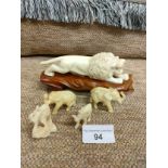 Bone style lion figure together with elephants etc.