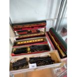 Shelf of 00 gauge loco and tender s parcial boxed together with coaches etc .