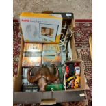 Box of miscellaneous includes lost DVD set , bull horn plaque , match box cars etc .