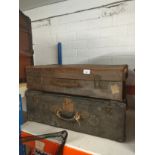 Two antique leather suitcases.