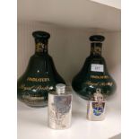 2 scotch whisky decanters together with 2 mini flasks .