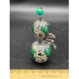 Oriental perfume bottle with dragon foliage .