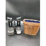 Set of world war naval and military field binocular s with parcial leather casing.