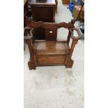 Antique hall armchair with fitted stick stand .