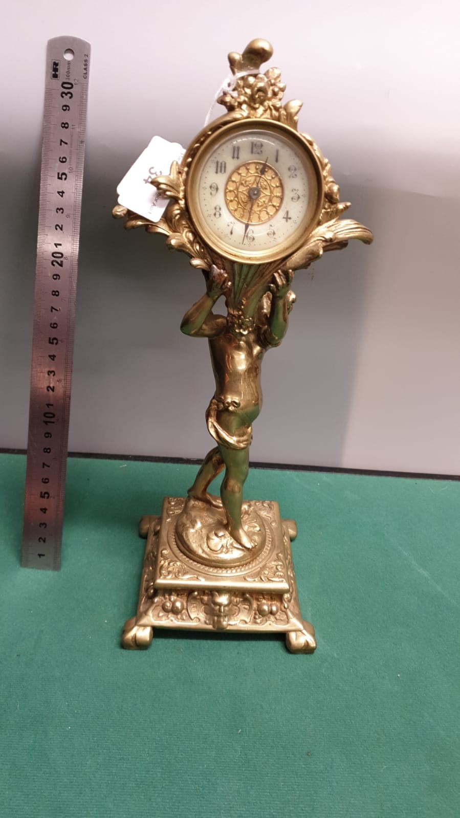 Beautiful Brass Victorian Clock With Putti Cherub Holding Clock Upright With Elaborate Art Work To