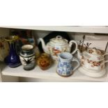 Shelf of studio pottery , Victorian porcelain etc .