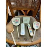 Petite point dressing table items .