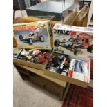 Boxed racing car remote control racing car and boxed racing car kits etc sold as seen .