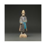 CHINA, MING DYNASTY GLAZED POTTERY ATTENDANT FIGURE