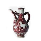 CHINESE IRON RED PORCELAIN JUG WITH DRAGONS