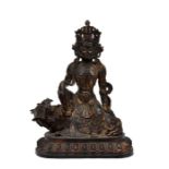 A sizable Sino Tibetan, Laquered and gilt Statue of Guan Yin sitting on a Snow Lion