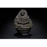 GANDHARA SCHIST STONE FIGURE OF SEATED BUDDHA