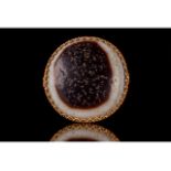 AN AGATE EYE DZI BEAD WITH GOLD FRAME-GEMOLOGICAL REPORT