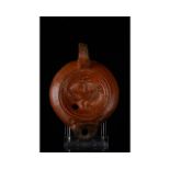 ROMAN TERRACOTTA OIL LAMP WITH EAGLE AND CADUCEUS