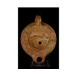 ROMAN TERRACOTTA OIL LAMP WITH DOG â€“ ORIGINAL PAPERWORK