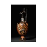 APULIAN RED-FIGURED TREFOIL OINOCHOE WITH FEMALE HEAD