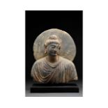 GANDHARA SCHIST STONE BUST OF BUDDHA WITH HALO