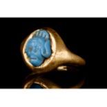 PHOENICIAN FAIENCE GODDESS HEAD IN A GOLD RING