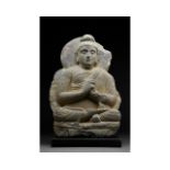 GANDHARA SCHIST FIGURE OF SEATED BUDDHA