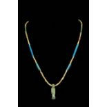 AN ANCIENT EGYPTIAN FAIENCE BEADED NECKLACE WITH THOTH AMULET