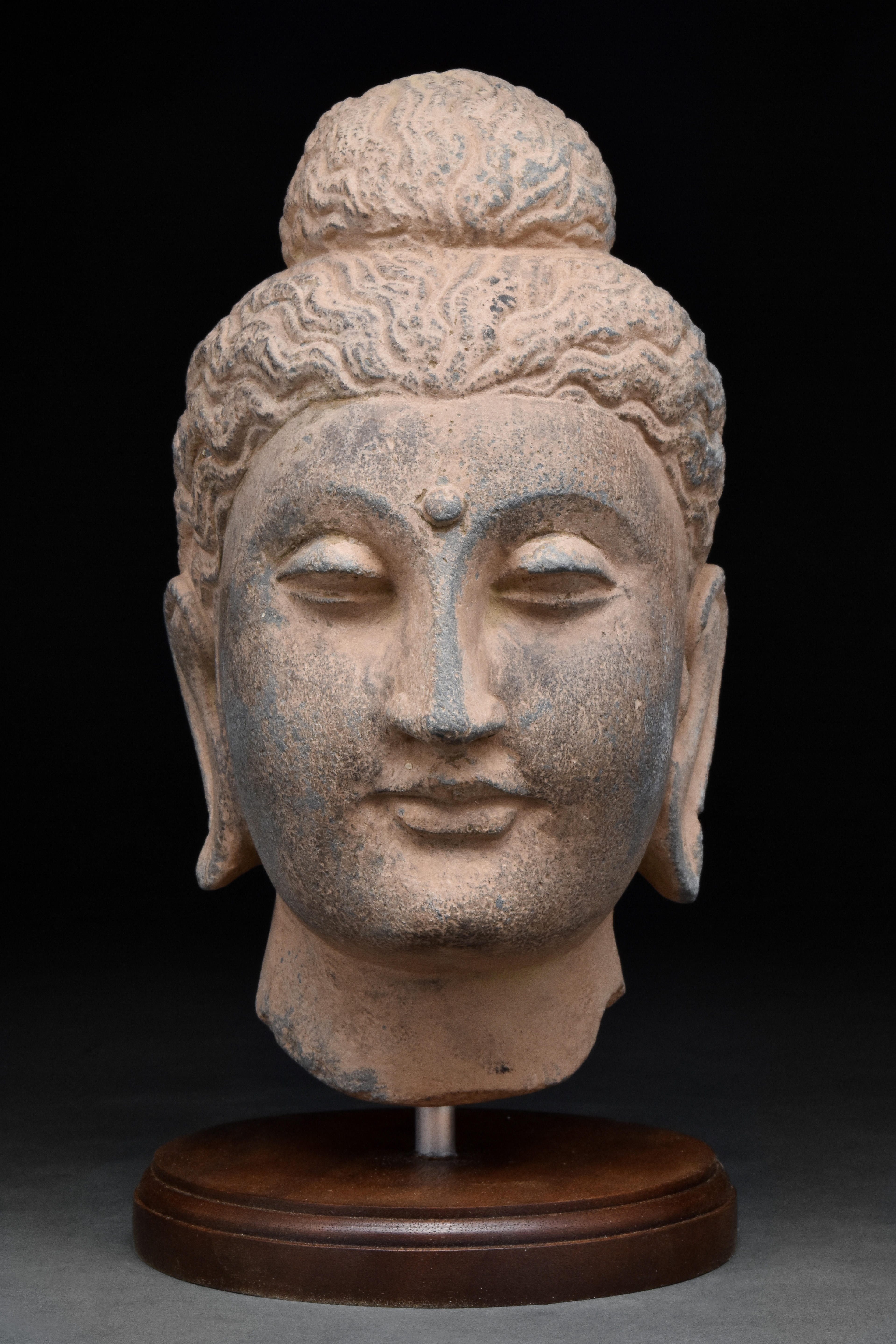 GANDHARAN HEAD OF A BUDDHA WITH STAND