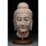 GANDHARAN HEAD OF A BUDDHA WITH STAND