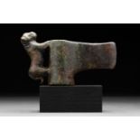 BRONZE SOCKETED AXE HEAD ON STAND WITH ANIMAL FIGURE