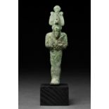 AN ANCIENT EGYPTIAN BRONZE VOTIVE FIGURE OF OSIRIS