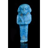 AN ANCIENT EGYPTIAN FAIENCE USHABTI