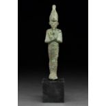 AN ANCIENT EGYPTIAN BRONZE VOTIVE FIGURE OF OSIRIS