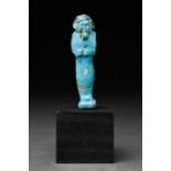 AN ANCIENT EGYPTIAN FAIENCE USHABTI