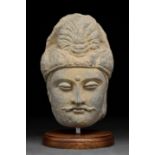 GANDHARAN HEAD OF A BODHISATTVA WITH STAND