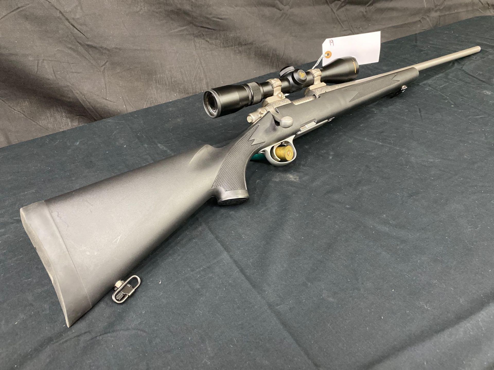 REMINGTON MODEL 700, 260 REM CAL, ENGRAVED, STAINLESS WITH NIKON BUCKMASTER SCOPE. SN#T6233064