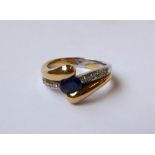 Bicolor-Ring mit Saphir