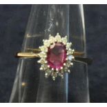 9ct gold ruby and diamond oval cluster ring. Size N. Approx weight 2.5g. (B.P. 21% + VAT)