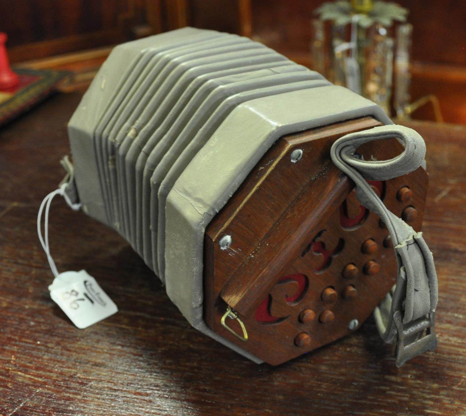 Simple concertina with appearing leather bellows. (B.P. 21% + VAT) Without case.