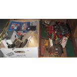 Two boxes of assorted model diecast vehicles, model of a Queen Mary ship, student microscopes