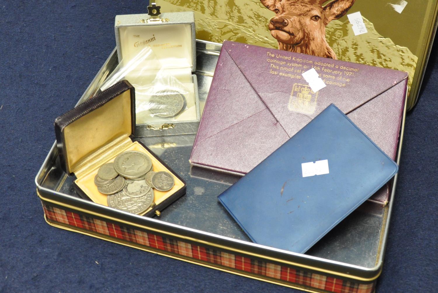 Modern biscuit tin containing assorted coins to include; silver half crown 1920 and a 1999 penny,