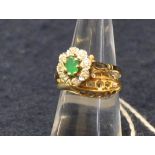 18ct gold and diamond ring (stones missing), size L and a 9ct gold gemset cluster ring, size O.